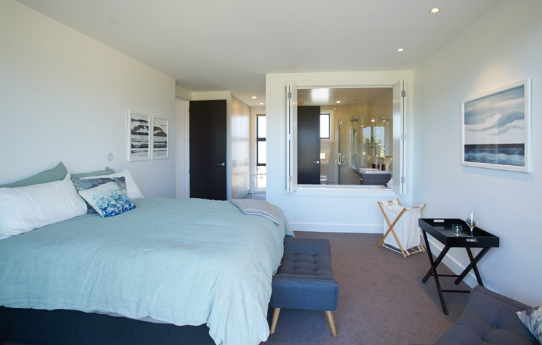 Photo of bed room with view into bathroom