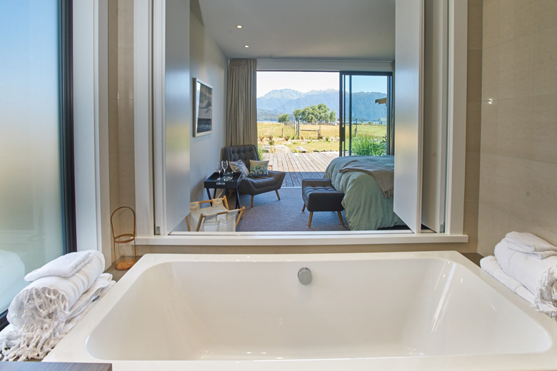 Image of bath with view of bedroom