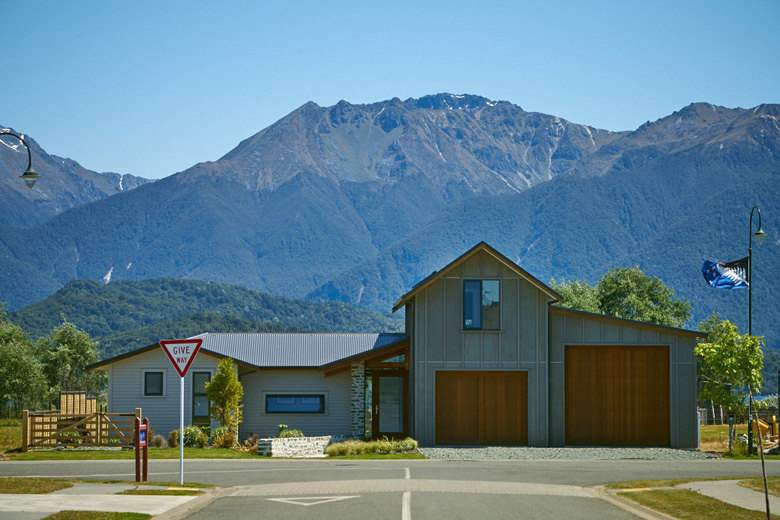 Picture of house from street with view of mountains in background