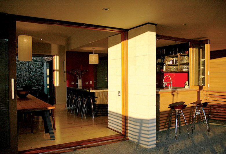 Looking inside into kitchen and dinning area from balcony