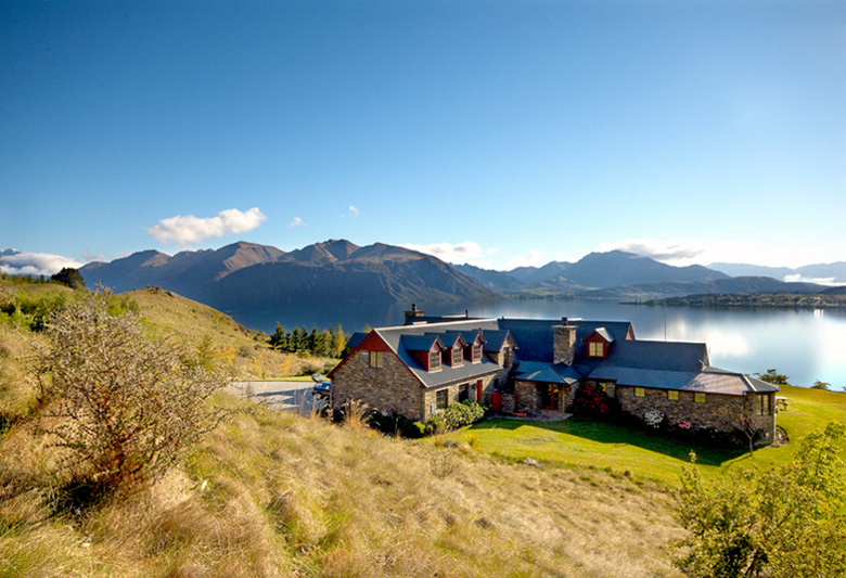 Long shot of Mount Aspiring Rd residence overlooking Lake Wanaka and surrounding mountains