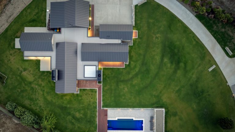 Drone view of house and pool