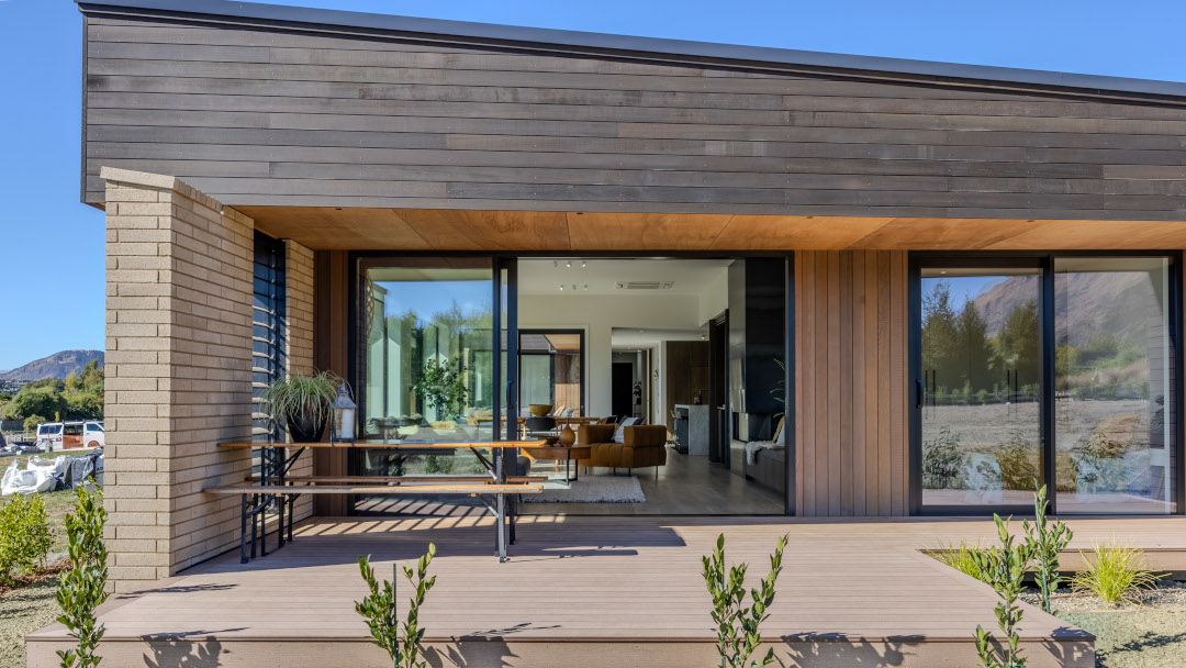 Side view of the north-facing deck leading to the living areas on one side and the master bedroom on the other.