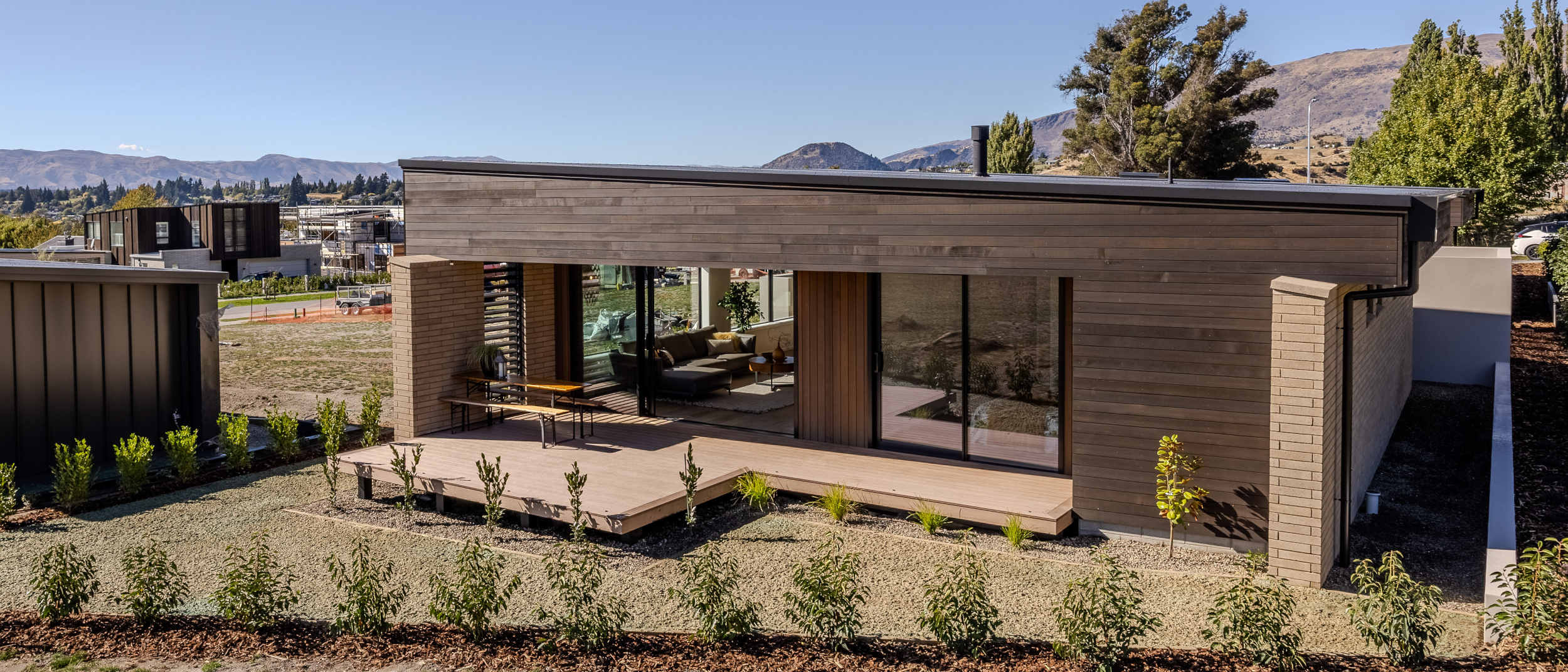 Side view of the north-facing deck leading to the living areas on one side and the master bedroom on the other.