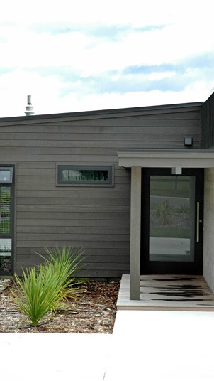 Entry with a large glass-panelled entry door.