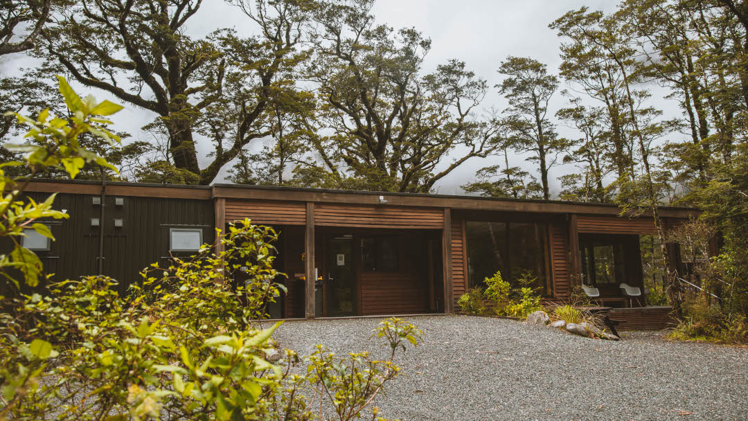 Cedar-clad amenities building set within a natural landscape, featuring contemporary design and warm timber exterior finishes.